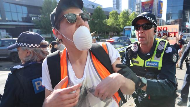 A protester is moved away by police. Picture: Alex Coppel.