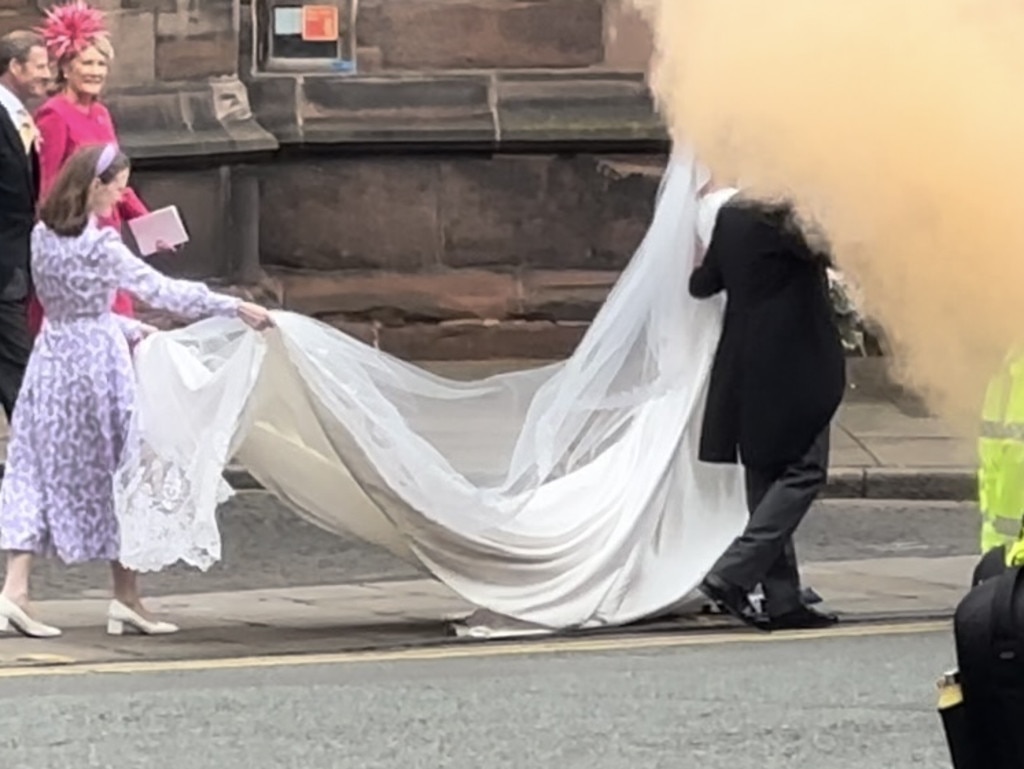 It was unleashed right as the newlyweds approached their post-ceremony vehicle. Picture: Bronte Coy