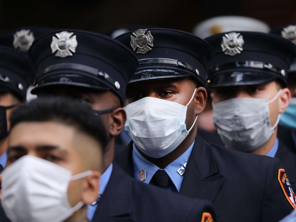 New York City firefighters pause to mark commemorations. Picture: Spencer Platt/Getty Images/AFP