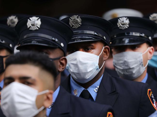 New York City firefighters pause to mark commemorations. Picture: Spencer Platt/Getty Images/AFP