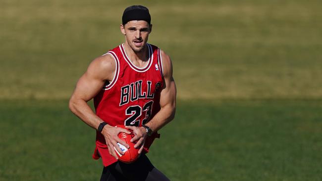 Collingwood captain Scott Pendlebury, wearing the famous Michael Jordan singlet, gets in some training at Elsternwick Park in Melbourne. Picture: AAP