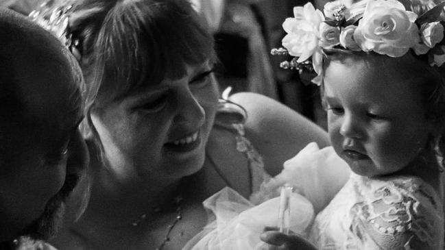 Troy and Danni Andrews with Evie at their wedding Picture: Supplied