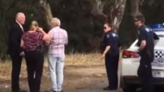 Police question the alleged paedophile (centre) who was confronted in the first sting operation.