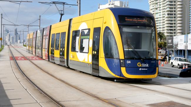 Gold Coast tram on the Southport Bridge . (sorry cloudy morning no sun ) . Picture Mike Batterham