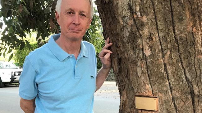 John Trevorrow with one of the four trees honouring his uncles who served in WW1 which are being chopped down in Churchill St, Mont Albert. Picture: Supplied.