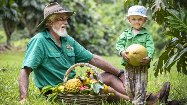 Exotic fruit farmer Peter Salleras and his grandson, Max. Picture: Brian Cassey