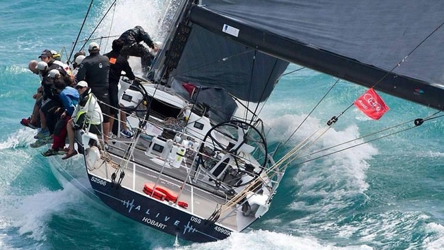 Racing yacht Alive powers through the water in the Sydney to Hobart Yacht Race.