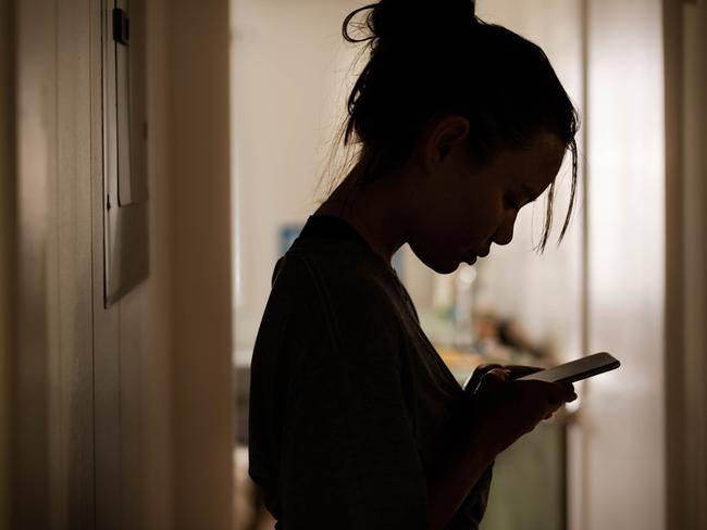 Silhouette of a gloomy girl getting a serious message