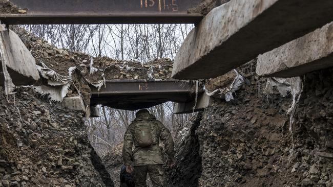 A Ukrainian soldier walks in a trench on the front line in Zolote, Ukraine. Picture: Getty Images.