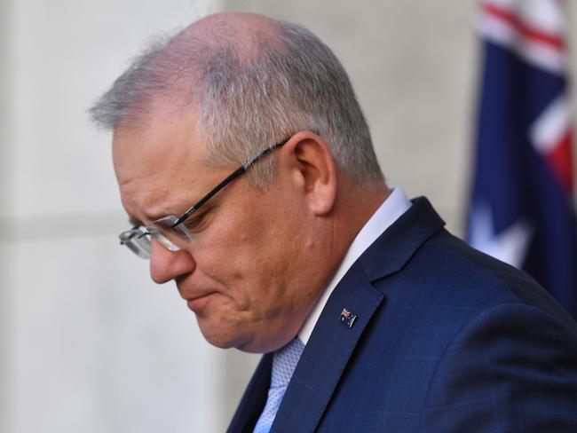 CANBERRA, AUSTRALIA - MAY 14: Prime Minister Scott Morrison reacts during a press conference in the Prime Ministers Courtyard at Parliament House on May 14, 2020 in Canberra, Australia. Australia's unemployment rate has recorded its biggest monthly rise ever, as 594,300 people lost jobs in April as coronavirus (COVID-19) restrictions shut thousands of businesses around the country and affected many more. The official jobless rate published by Australian Bureau of Statistics (ABS) has now climbed to 6.2 per cent.  (Photo by Sam Mooy/Getty Images)