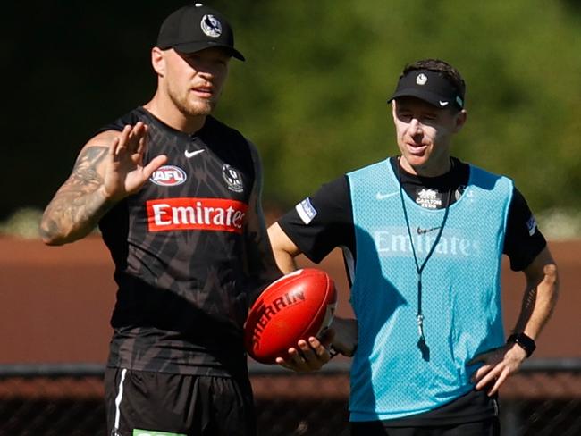 Jordan De Goey speaks with Craig McRae at Pies training. Picture: AFL Photos/Getty Images