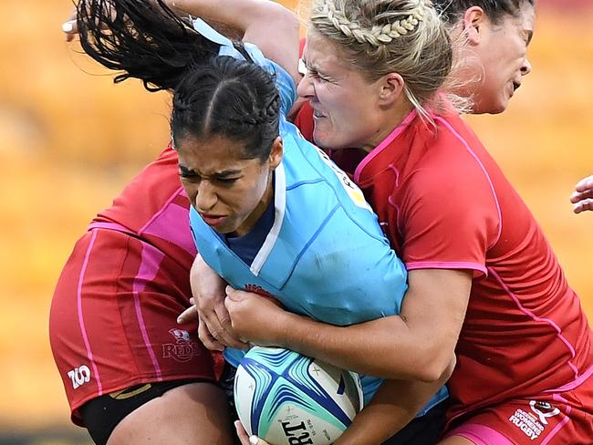 BRISBANE, AUSTRALIA - MARCH 10:  Crystal Maguire of New South Wales takes on the defence during the Super W match between Queensland Women and New South Wales Women at Suncorp Stadium on March 10, 2018 in Brisbane, Australia.  (Photo by Bradley Kanaris/Getty Images)
