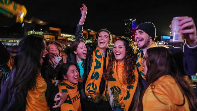 Fans at Sydney's FIFA Fan Site celebrate after watching the Matildas