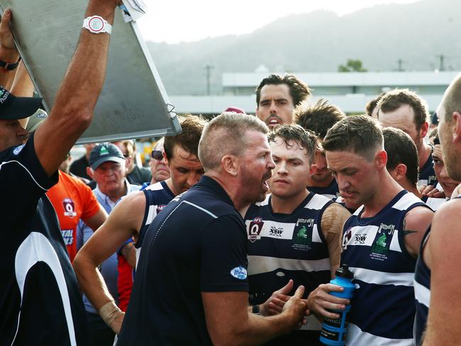 Port Douglas coach Brad Cooper rallies his players at three quarter time in last season’s AFL Cairns grand final at Cazalys Stadium. Picture: Brendan Radke