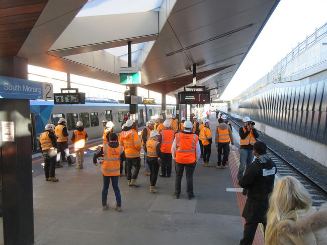 Workers await the first Mernda test train at South Morang Station. Picture: Darren Peters