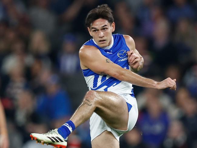 MELBOURNE, AUSTRALIA - MAY 04: Zac Fisher of the Kangaroos kicks the ball during the 2024 AFL Round 08 match between the St Kilda Saints and the North Melbourne Kangaroos at Marvel Stadium on May 04, 2024 in Melbourne, Australia. (Photo by Michael Willson/AFL Photos via Getty Images)