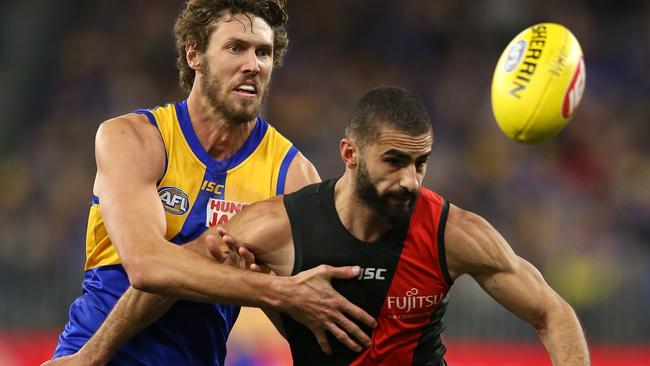 Tom Hickey of the Eagles and Adam Saad of the Bombers contest for the ball.