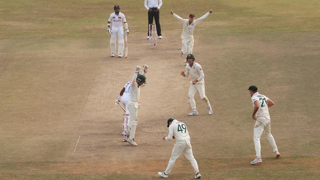 Australia’s Matt Kuhnemann takes the prized wicket of Sri Lanka’s Prabath Jayasuriya, caught by Steve Smith, on day three of the second Test in Galle (Photo by Robert Cianflone/Getty Images)