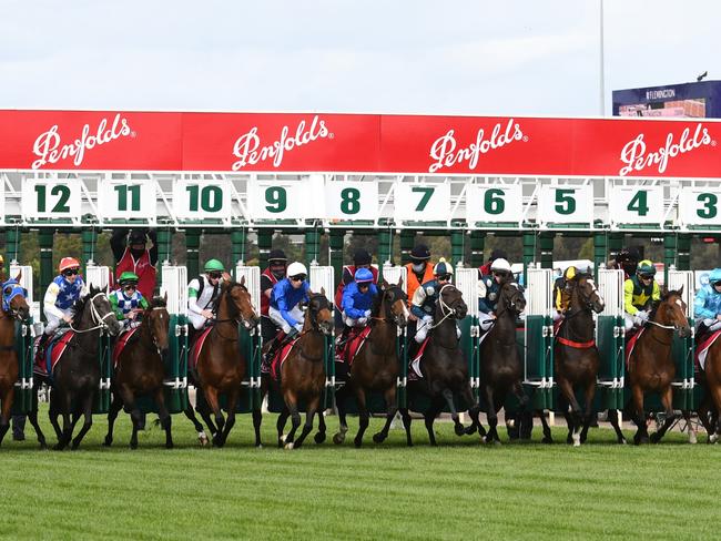 MELBOURNE, AUSTRALIA - OCTOBER 30: John Allen riding Hitotsu jumps out of barrier six before winning race 6, the Penfolds Victoria Derby, during 2021 AAMI Victoria Derby Day at Flemington Racecourse on October 30, 2021 in Melbourne, Australia. (Photo by Vince Caligiuri/Getty Images)