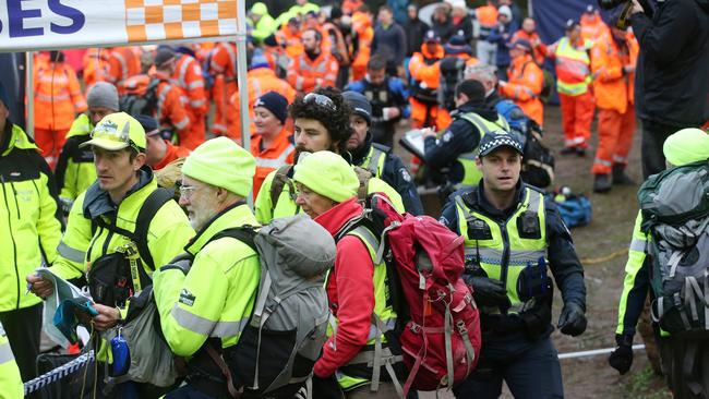 Search crews flocked to the mountain to help. Picture: David Crosling