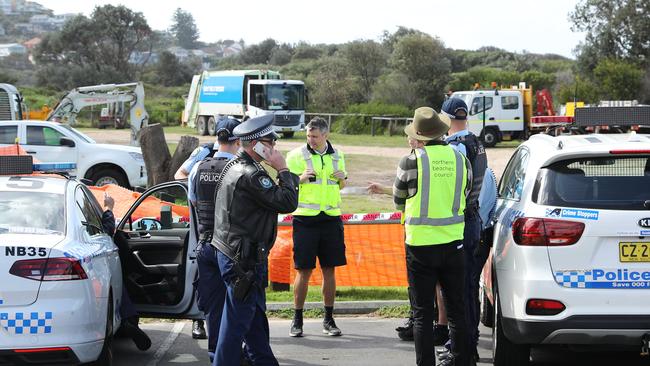 DAILY TELEGRAPH. Police move in to assist Northern Beaches Council workers as the evict and demolishing a camp where people have been living in the dunes at Dee Why Beach. 31/08/2023. Pic by Max Mason-Hubers