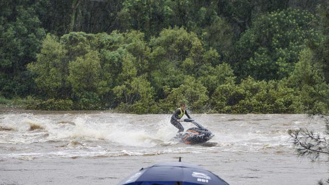 A jet ski rider in flood waters. Picture: Luke Sorensen