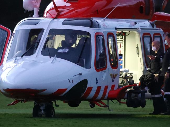 The Air Ambulance lands on the oval at Jan Juc to assist a boy injured in a bike accident. Picture: Alison Wynd