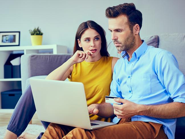 A couple who are stressed about money working out their finances together and assessing their credit card debt. Picture: iStock.