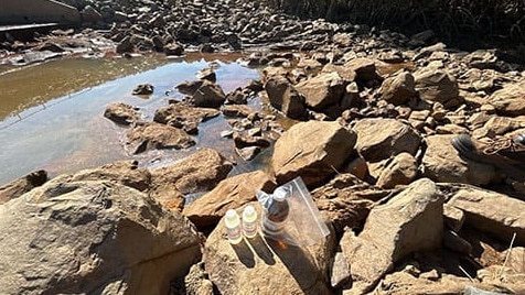 The NT EPA has issued more than $26,000 in fines for oil spills in Darwin. Officers sampled the downgradient outfall drain for hydrocarbons, collecting evidence used to confirm an offence. Pic: Supplied.