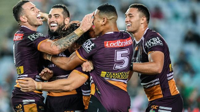 The Broncos celebrate their impressive win over Souths