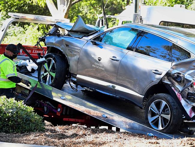 A tow truck recovers the vehicle driven by golfer Tiger Woods. Picture: AFP