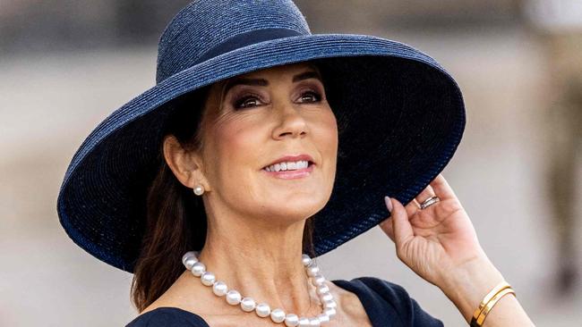 Queen Mary of Denmark (R) and King Frederik X of Denmark watch overflying fighter jets at the parade on Denmark's flag day for Denmark's deployed at the Christiansborg Palace Square in Copenhagen, on September 5, 2024. (Photo by Ida Marie Odgaard / Ritzau Scanpix / AFP) / Denmark OUT