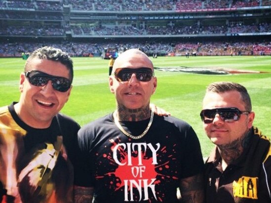 Kazem Hamad (left) at the footy with Toby Mitchell and senior Mongol bikie Tyrone Bell prior to being deported. Picture: Instagram