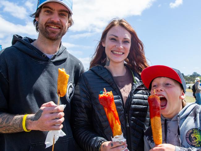 Hobart, Tasmania. Royal Hobart Show, Friday 27th October 2023. Jay Wooley, Meg Sullivan and Damian Faulds enjoying their Dagwood dogs at the Royal Hobart Show.Picture: Linda Higginson