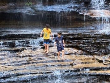 The boys playing in a waterfall. Picture: Facebook/ Trish Smith