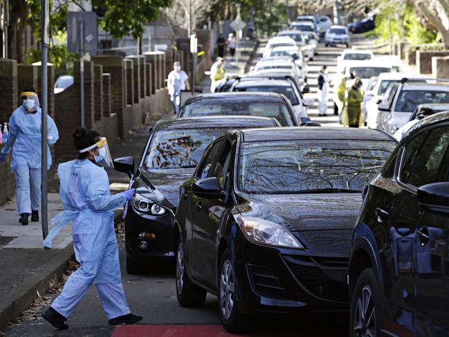 Long lines of cars waiting to be tested at the COVID-19 drive-in site at Rozelle. Picture: Adam Yip