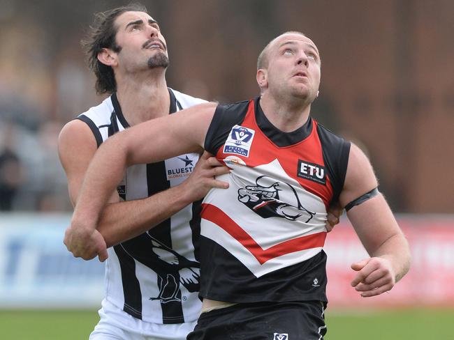 Collingwood ruckman Brodie Grundy battles it out with Frankston counterpart Russell Gabriel.