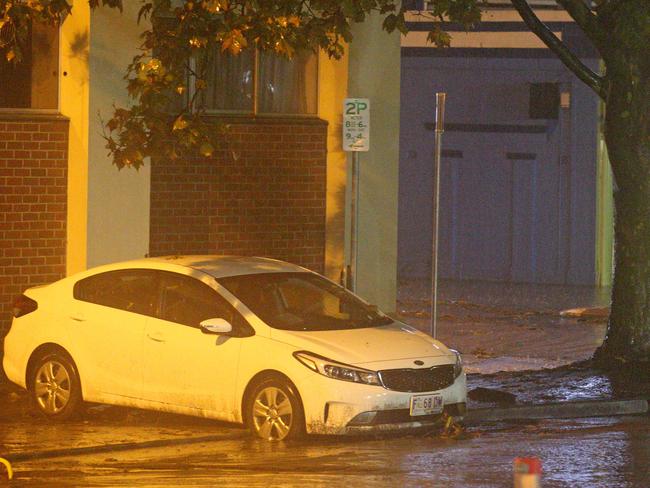 An overnight storm left devastation in its wake as it swept through Hobart, flooding the CBD and sweeping cars down city streets. Picture: Patrick Gee