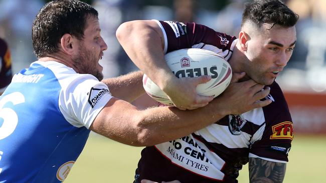 Jordan Scott runs the ball for Burleigh. Richard Gosling