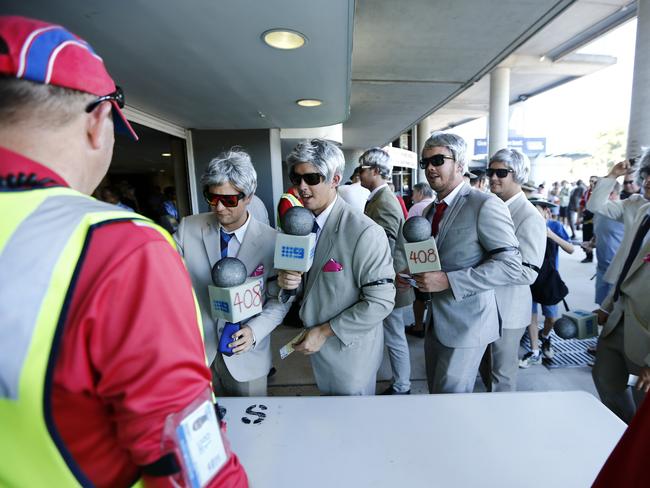 Dozens of Richie Benaud impersonators file into the stadium. Picture: Tim Hunter.