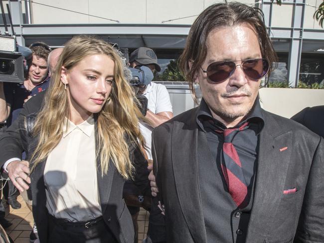 Johnny Depp and wife Amber Heard leave The Southport Court, Southport, Queensland, Monday April 18, 2016. Heard pleaded guilty in the Southport Magistrates Court to providing a false document after failing to tell customs she was entering the country with the pair's Yorkshire terriers, Pistol and Boo, last April. (AAP Image/Glenn Hunt) NO ARCHIVING