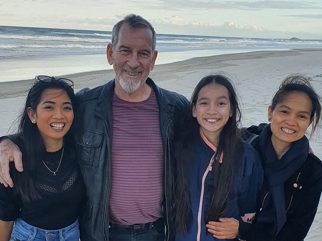 Sarah Caisip (left) pictured with her father Bernard, was unable to attend his funeral in Brisbane on Thursday.