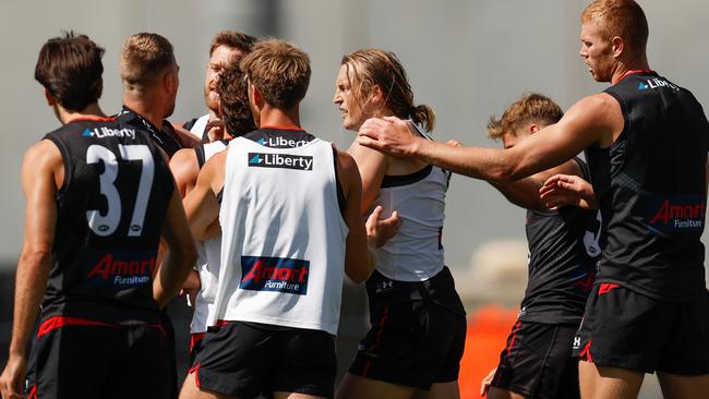 Teammates move in to separate Jake Stringer and Mason Redman. Picture: Michael Willson/AFL Photos via Getty Images