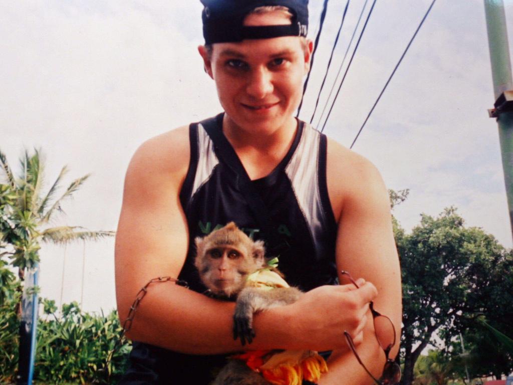 Scott Rush with a monkey in Bali before he was arrested for drug smuggling.