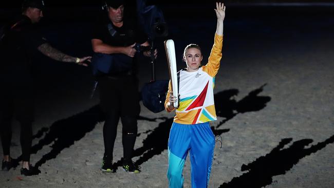 Sally Pearson showcases The Queen's Baton during the Opening Ceremony for the Gold Coast 2018 Commonwealth Games at Carrara Stadium on April 4, 2018 on the Gold Coast, Australia. Photo: Hannah Peters