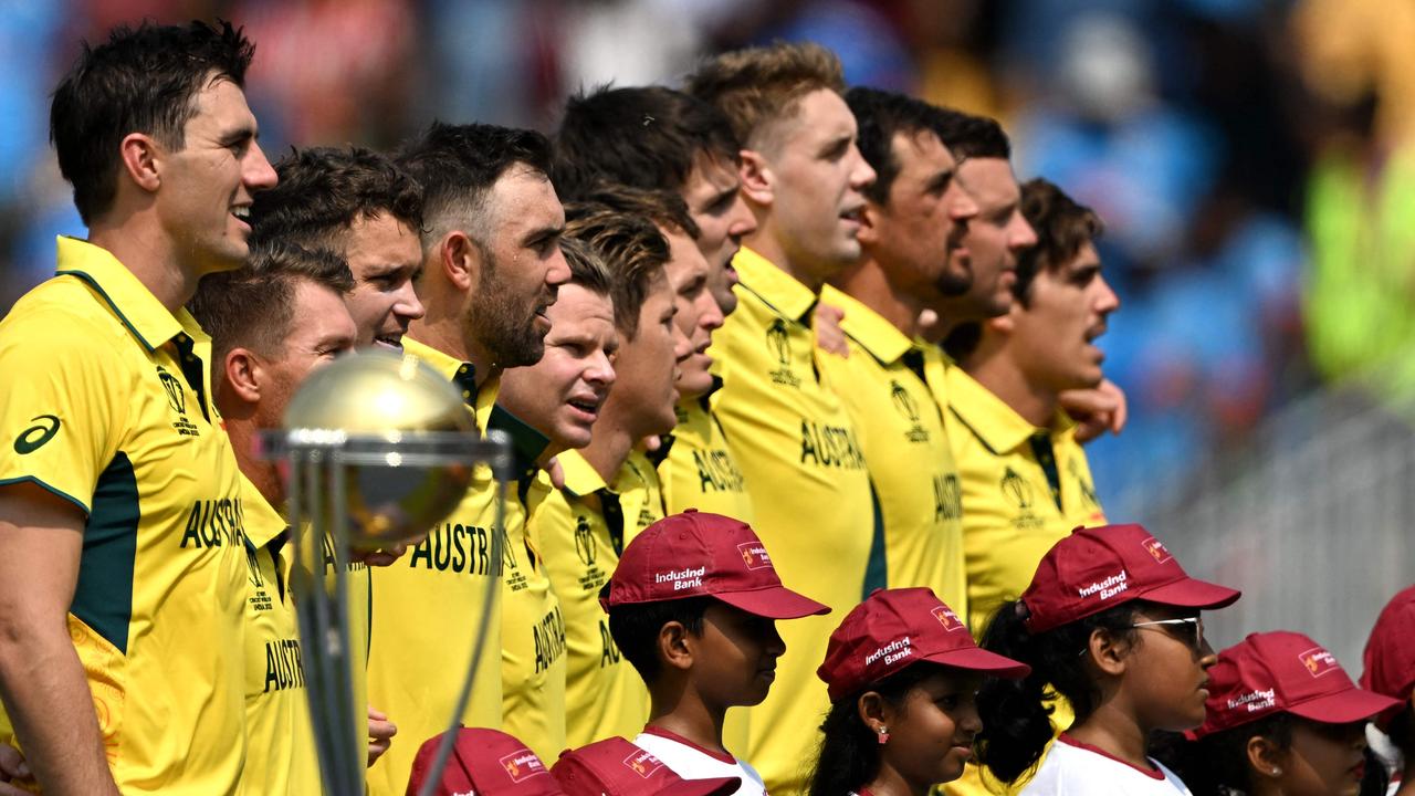 Australia's players sing their national anthem before their clash with India. (Photo by Punit PARANJPE / AFP)