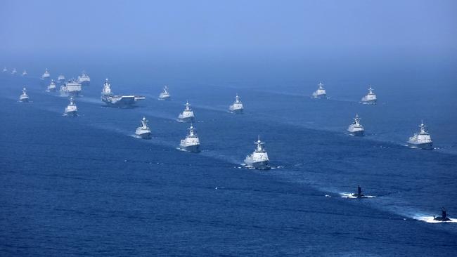 The Liaoning aircraft carrier is accompanied by navy frigates and submarines conducting exercises in the South China Sea. Picture: AP