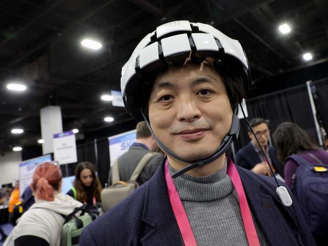 Founder and CEO of iMediSync Inc. Dr. Seung Wan Kang displays the new consumer version of iMedisync's iSyncWave for digital brain health monitoring with AI brain mapping and LED therapy during a press event at CES 2023 at the Mandalay Bay Convention Center on January 03, 2023 in Las Vegas, Nevada. The brainâ&#128;&#147;computer interface machine allows individual brain scanning at home so people can measure their brainwaves by themselves and then discuss results with their doctors. Ethan Miller/Getty Images/AFP (Photo by Ethan Miller / GETTY IMAGES NORTH AMERICA / Getty Images via AFP)