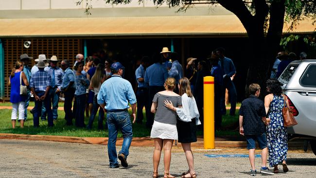 Family and friends arrive at Casuarina Street primary school for Dolly Everett's memorial service in Katherine, Northern Territory.