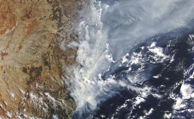 A satellite photo taken by NASA shows the weather condition as bushfires burn in the eastern part of NSW. Picture: NASA via AP